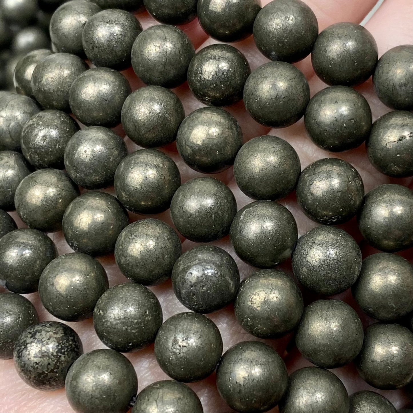 Pyrite 8mm Round Bead Crystal Bracelet