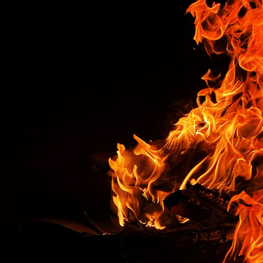 a close up of a fire in the dark