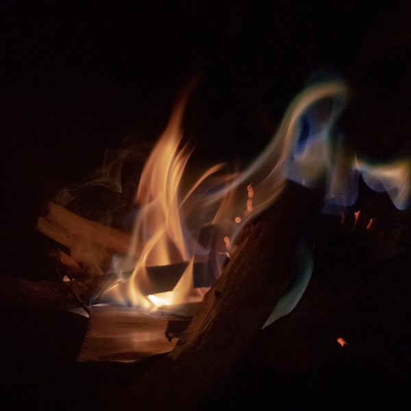 a close up of a fire in the dark