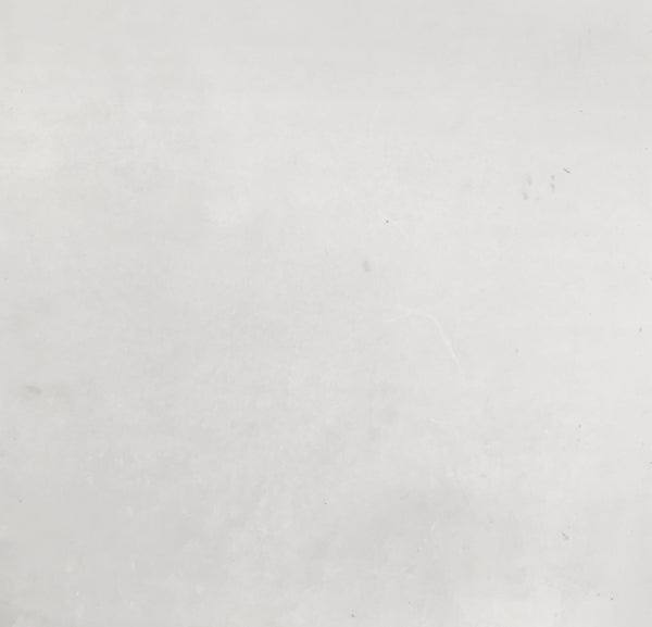 a black and white photo of a person on a surfboard