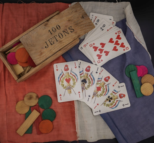 A table topped with lots of playing cards