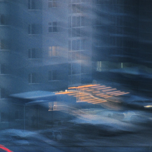 A blurry picture of a building with a clock on it