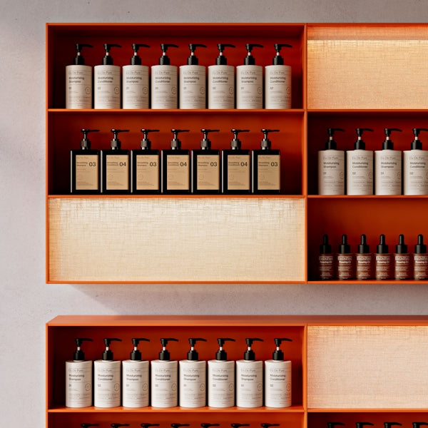 Bottles of toiletries neatly arranged on shelves.